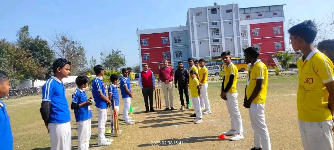 Students playing cricket
