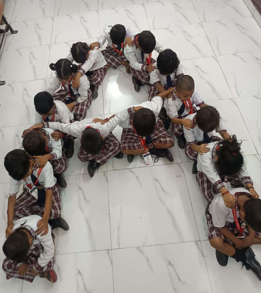 SRJ Academy students forming letter A