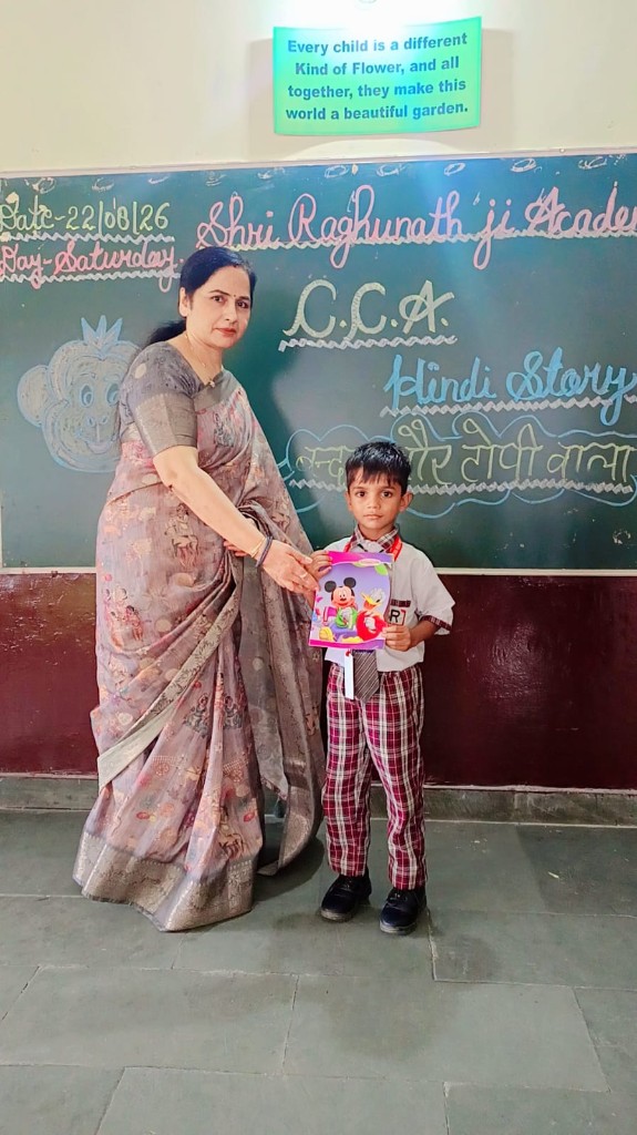 Student receiving Hindi story CCA prize at Shri Raghunath Ji Academy
